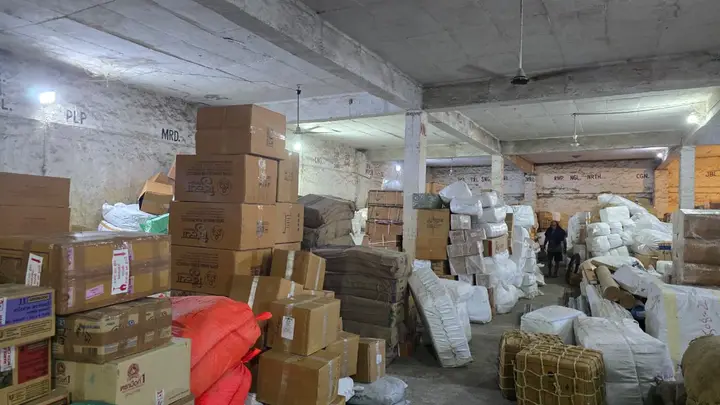 Cartons and parcels sorted by destination inside the Shimla Manali Goods Carrier godown