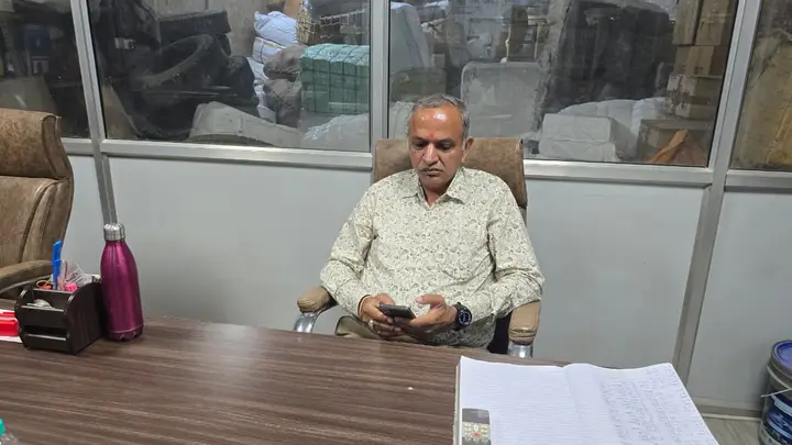 Sanjay Gupta, Owner of Shimla Manali Goods Carrier Pvt. Ltd., at his office desk