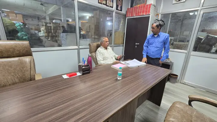 Sanjay Gupta, Owner of Shimla Manali Goods Carrier Pvt. Ltd., at his desk in the booking office